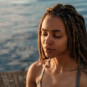 Woman with braids meditating